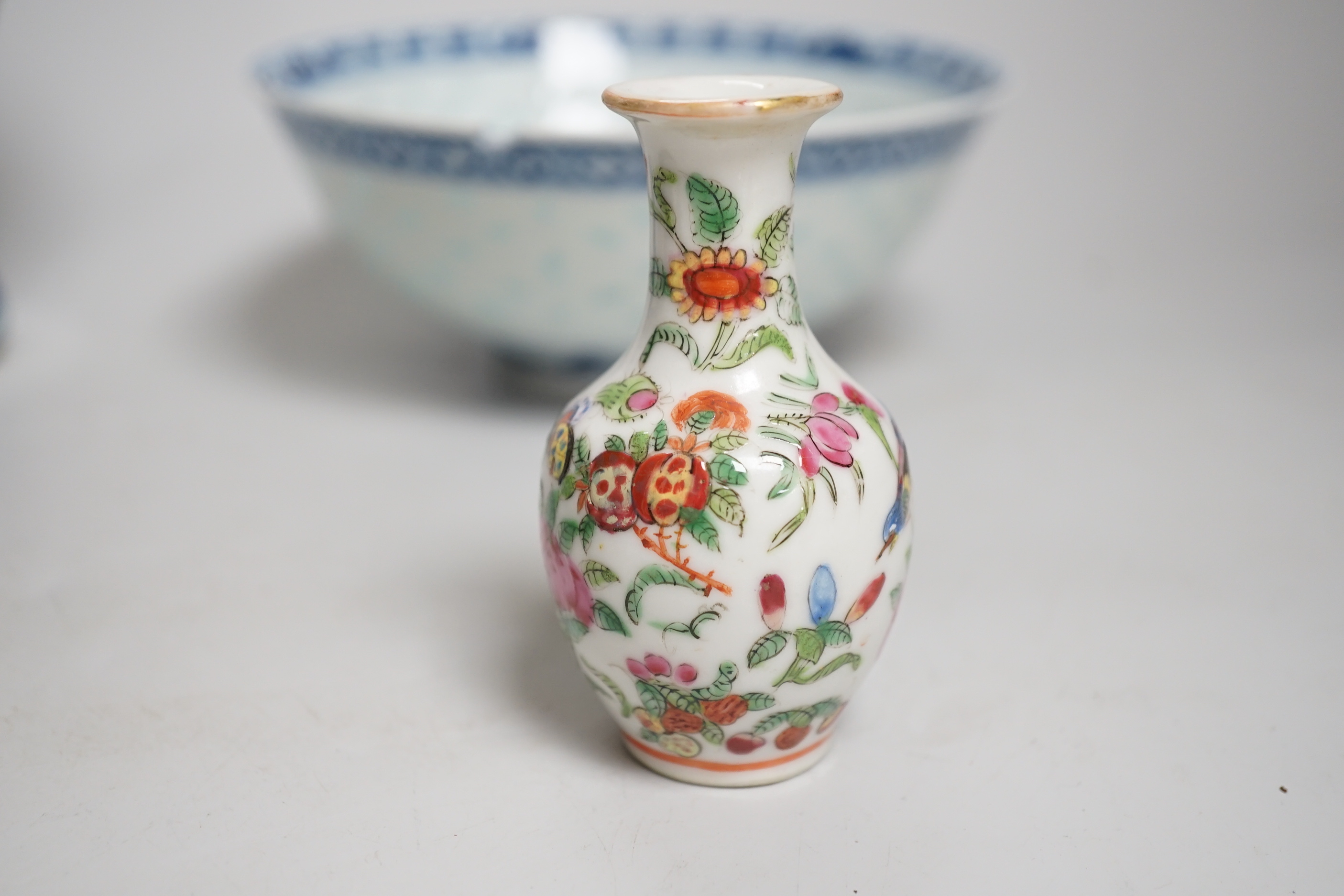 Chinese blue and white ceramics and a miniature famille rose vase, the largest 25cm high